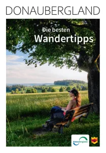 Titelbild mit der Überschrift Donaubergland mit einer Wanderin auf einer Bank, die in die Natur blickt