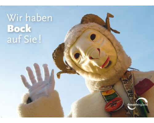 Donaubergland Postkartenmotiv mit einem winkenden Narr mit Bock-Maske.